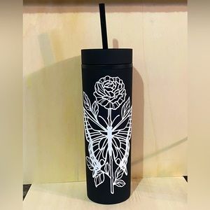 Black to-go cup with white floral/butterfly design